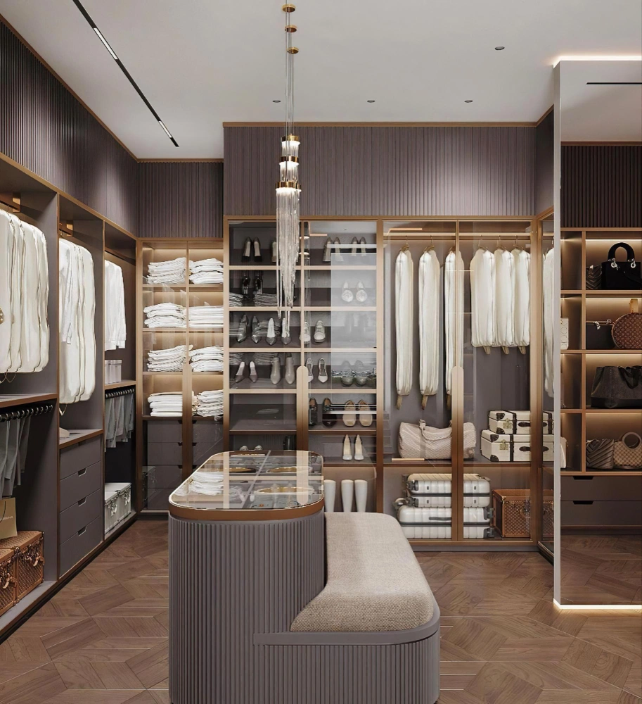 Luxury boutique walk-in closet with glass-front wardrobes, shoe displays, and center island by Los Angeles Closet in Los Angeles CA